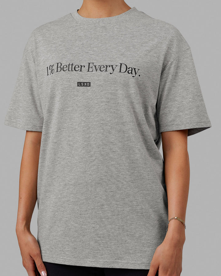 Woman  wearing Unisex 1% Better FLXCotton Tee Oversize - Lt Grey Marl-Black