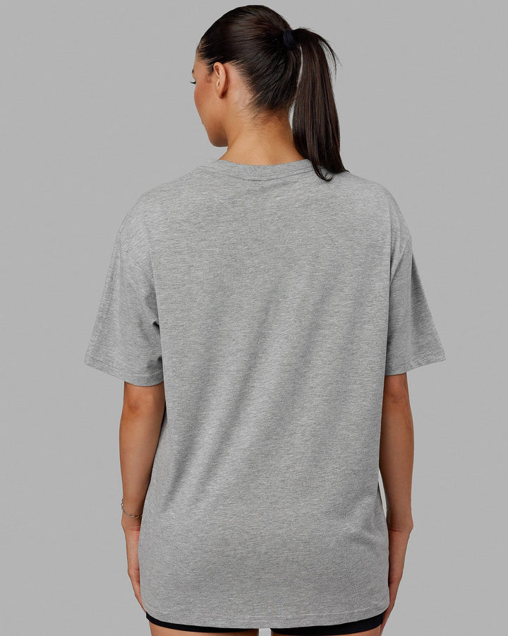 Woman  wearing Unisex 1% Better FLXCotton Tee Oversize - Lt Grey Marl-Black