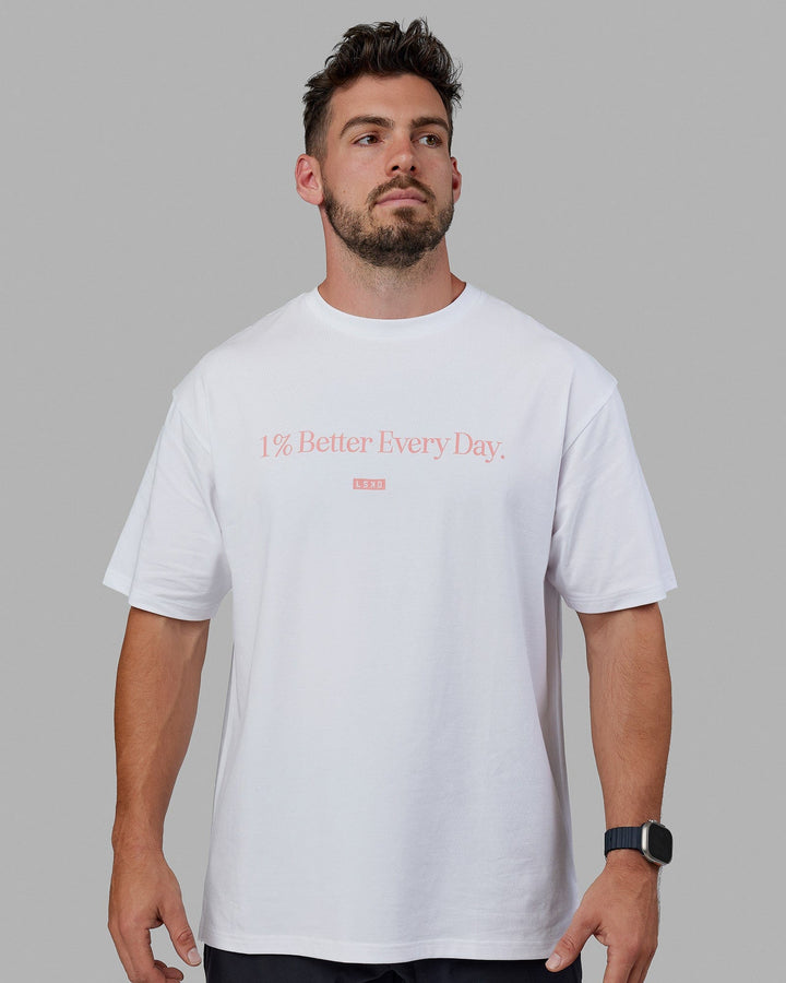 Man wearing Unisex 1% Better FLXCotton Tee Oversize - White-Coral