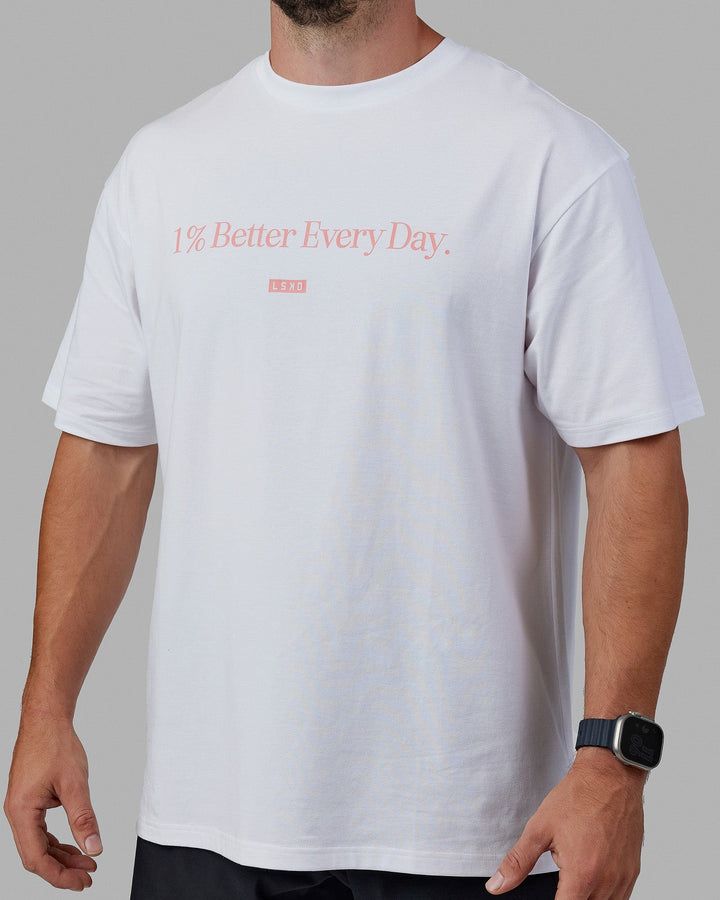 Man wearing Unisex 1% Better FLXCotton Tee Oversize - White-Coral
