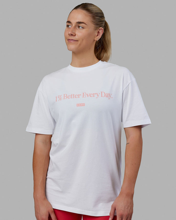 Woman wearing Unisex 1% Better FLXCotton Tee Oversize - White-Coral
