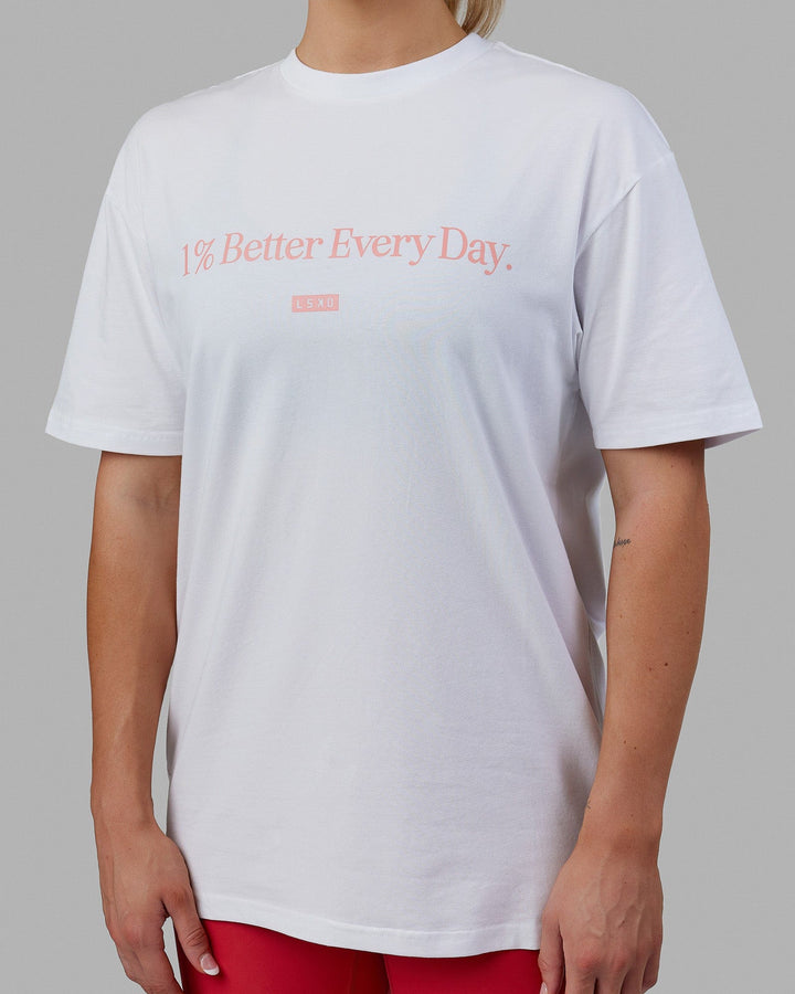 Woman wearing Unisex 1% Better FLXCotton Tee Oversize - White-Coral