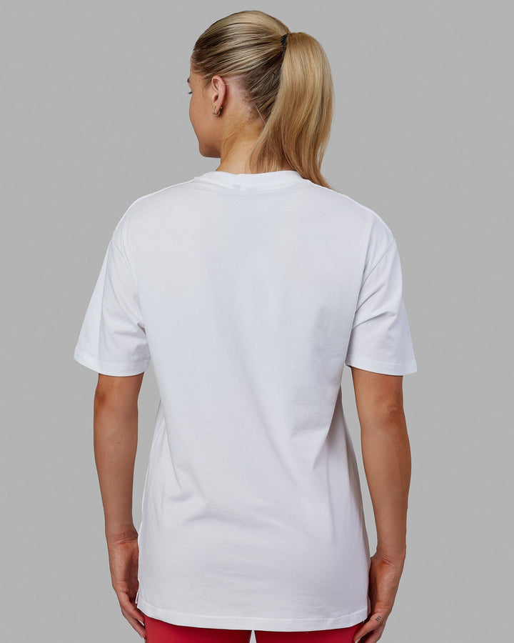 Woman wearing Unisex 1% Better FLXCotton Tee Oversize - White-Coral