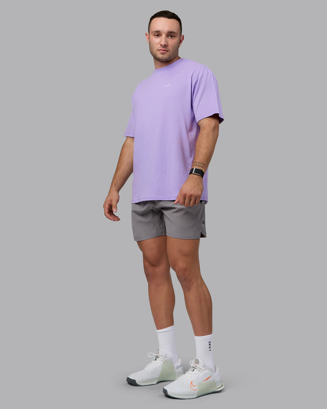 Man wearing Unisex 1% Better Value Series FLXCotton Tee Oversize - Pale Lilac-White