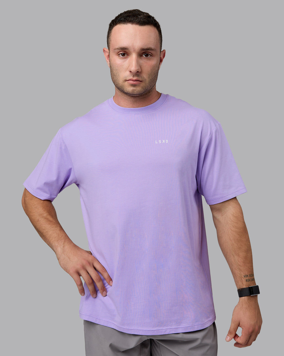 Man wearing Unisex 1% Better Value Series FLXCotton Tee Oversize - Pale Lilac-White
