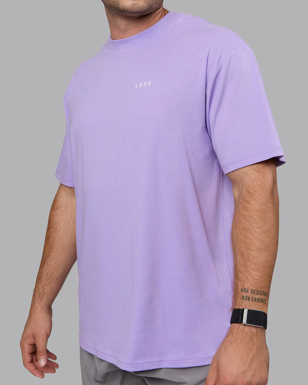 Man wearing Unisex 1% Better Value Series FLXCotton Tee Oversize - Pale Lilac-White