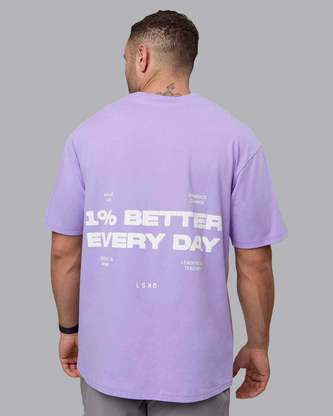 Man wearing Unisex 1% Better Value Series FLXCotton Tee Oversize - Pale Lilac-White