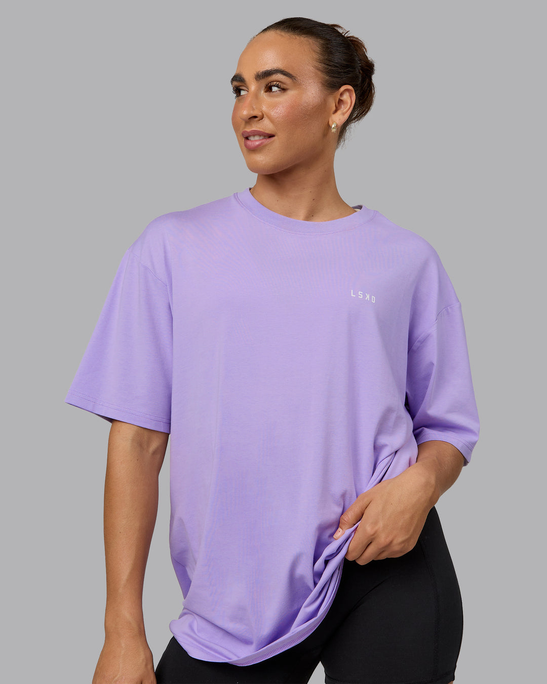 Woman wearing Unisex 1% Better Value Series FLXCotton Tee Oversize - Pale Lilac-White