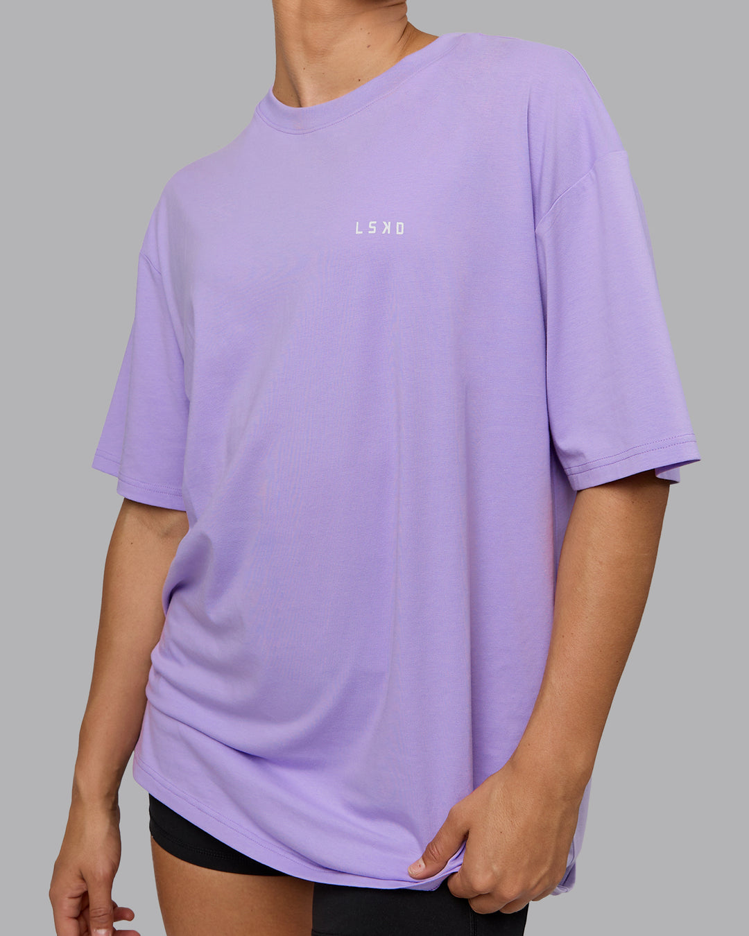 Woman wearing Unisex 1% Better Value Series FLXCotton Tee Oversize - Pale Lilac-White