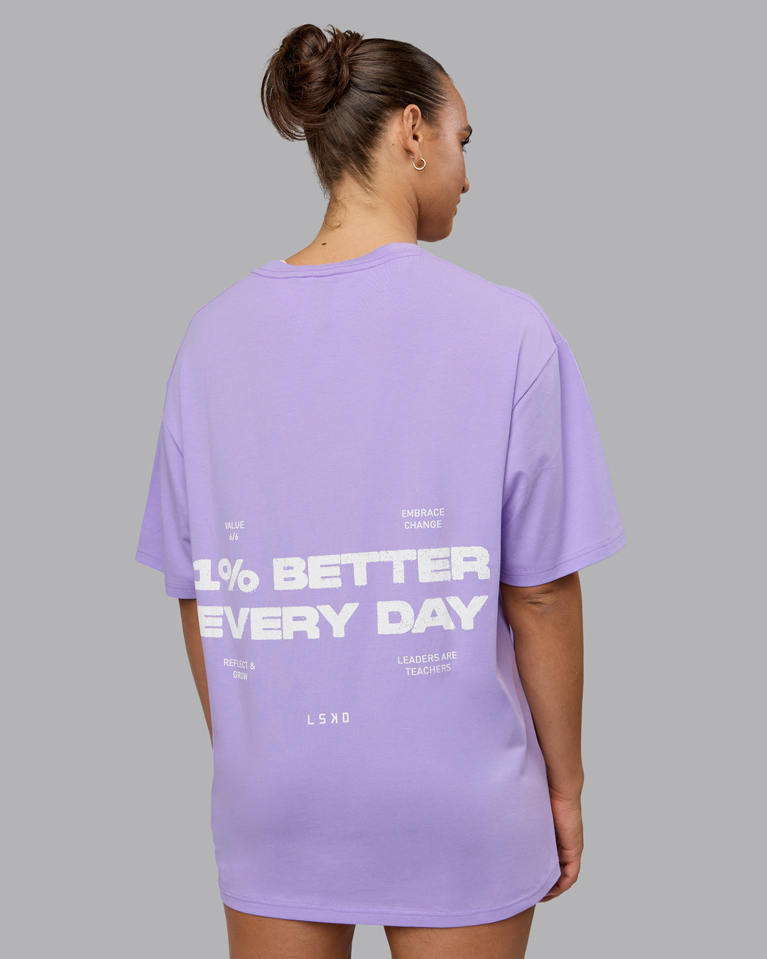 Woman wearing Unisex 1% Better Value Series FLXCotton Tee Oversize - Pale Lilac-White