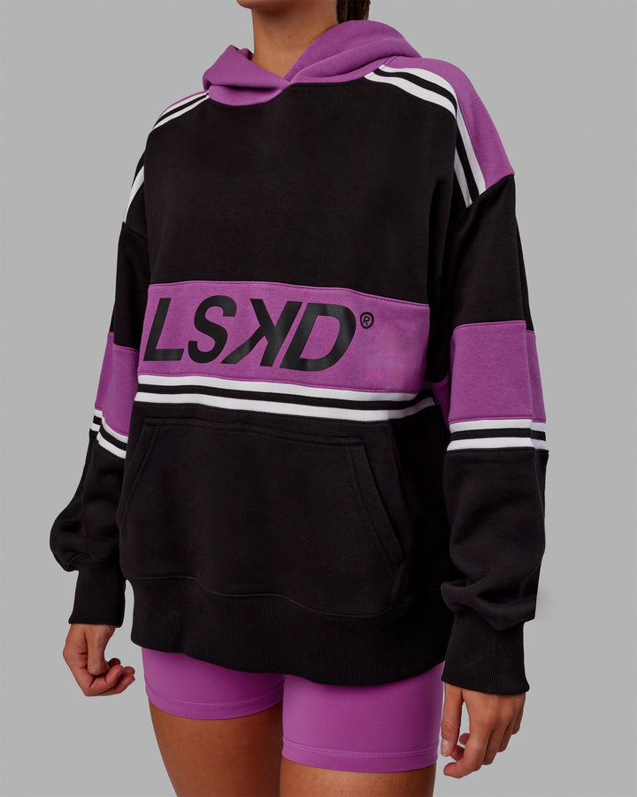 Woman wearing Unisex A-Team Hoodie Oversize - Black-Hyper Violet