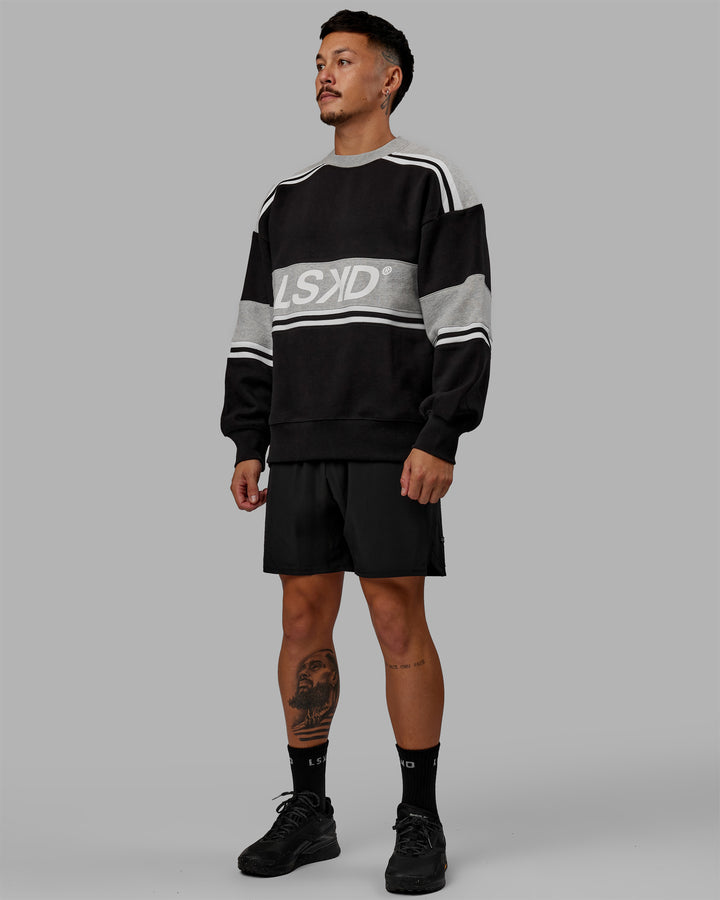 Man wearing Unisex A-Team Sweater Oversize - Black-Light Grey Marl