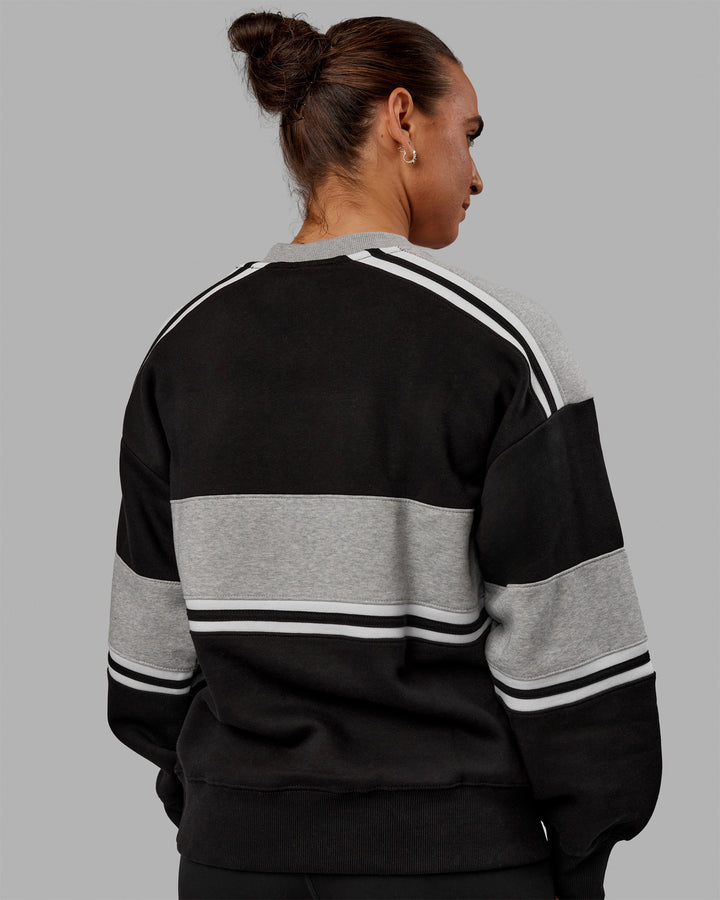 Woman wearing Unisex A-Team Sweater Oversize - Black-Light Grey Marl