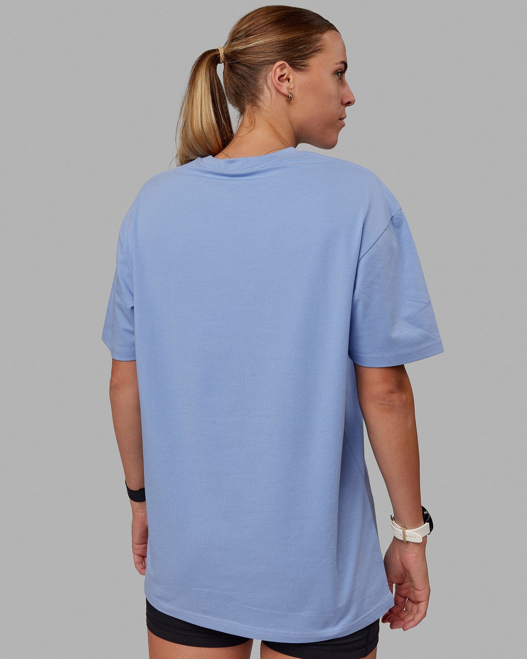 Woman wearing Unisex Better Every Day FLXCotton Tee Oversize - Arctic Blue-Ultra Pink