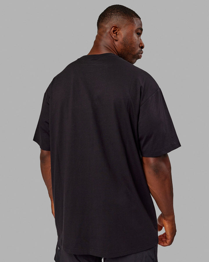 Man wearing Unisex Better Every Day FLXCotton Tee Oversize - Black-Ultimate Grey