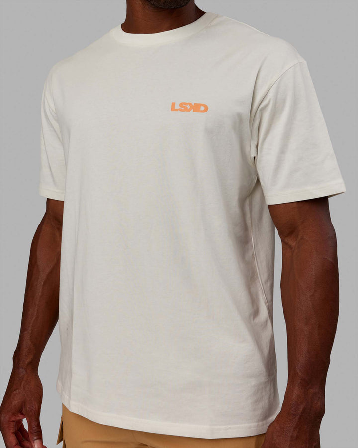 Man wearing Unisex E.T.J FLXCotton Tee Oversize - Off White-Tangerine