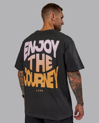 Man wearing Unisex E.T.J FLXCotton Tee Oversize - Pirate Black-Pop Pink