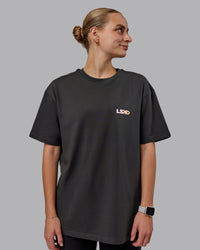 Woman wearing Unisex E.T.J FLXCotton Tee Oversize - Pirate Black-Pop Pink