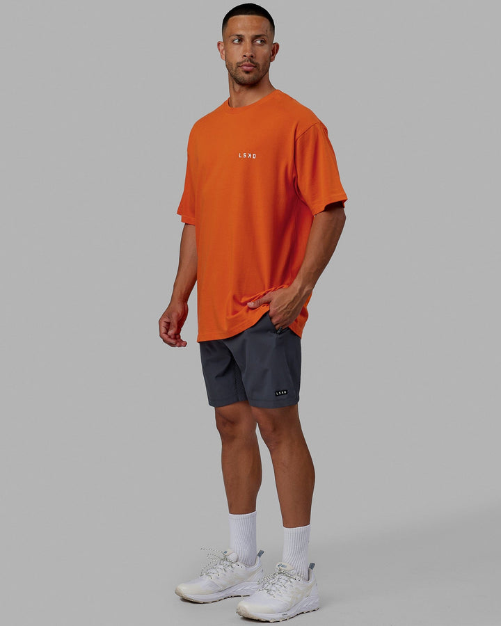 Man wearing Unisex Endeavour Heavyweight Tee Oversize - Impact Orange