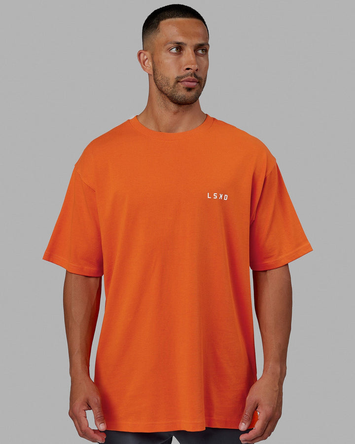 Man wearing Unisex Endeavour Heavyweight Tee Oversize - Impact Orange
