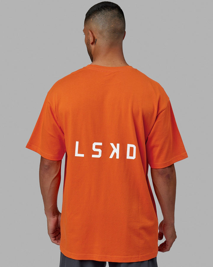 Man wearing Unisex Endeavour Heavyweight Tee Oversize - Impact Orange