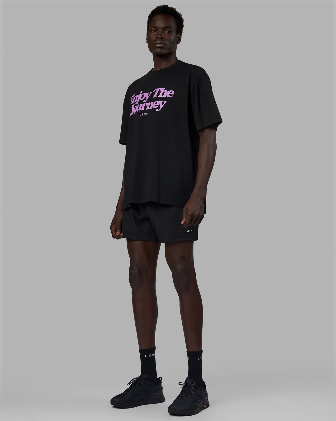 Man wearing Unisex Enjoy The Journey FLXCotton Tee Oversize - Black-Light Violet