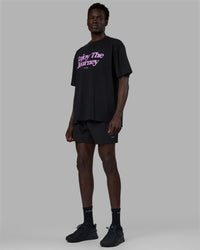 Man wearing Unisex Enjoy The Journey FLXCotton Tee Oversize - Black-Light Violet
