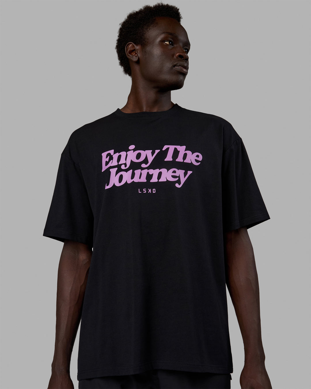 Man wearing Unisex Enjoy The Journey FLXCotton Tee Oversize - Black-Light Violet