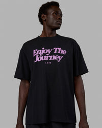 Man wearing Unisex Enjoy The Journey FLXCotton Tee Oversize - Black-Light Violet