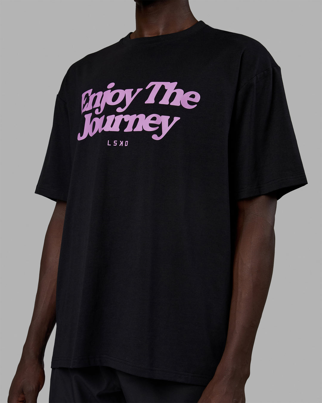 Man wearing Unisex Enjoy The Journey FLXCotton Tee Oversize - Black-Light Violet