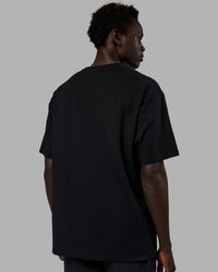 Man wearing Unisex Enjoy The Journey FLXCotton Tee Oversize - Black-Light Violet
