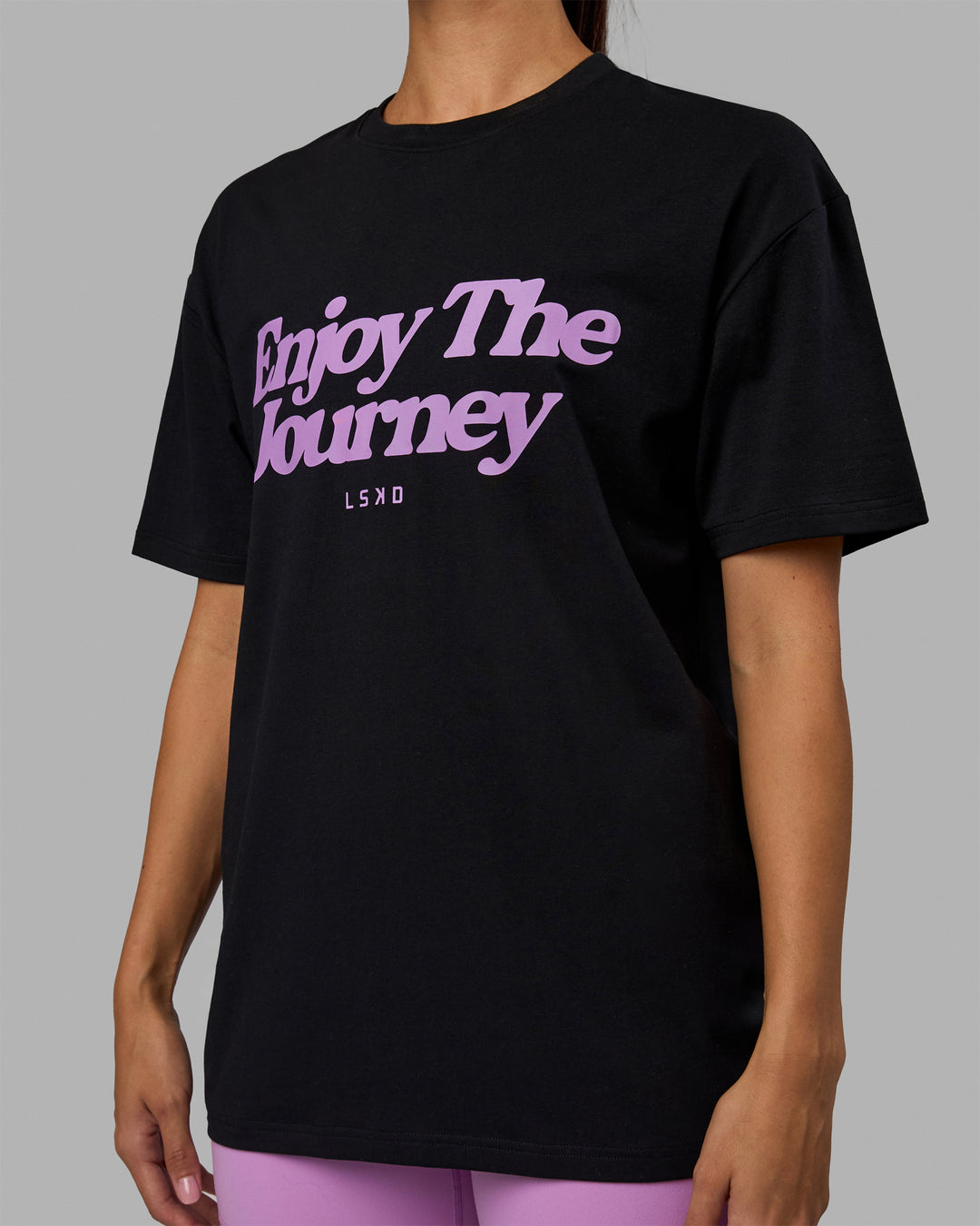 Woman wearing Unisex Enjoy The Journey FLXCotton Tee Oversize - Black-Light Violet
