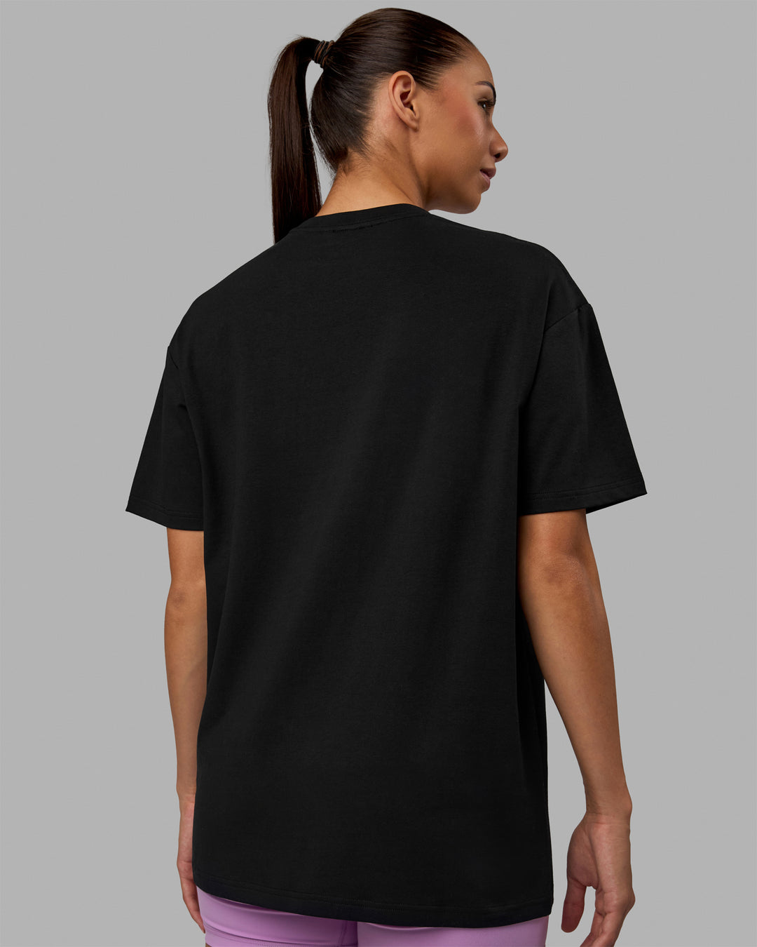 Woman wearing Unisex Enjoy The Journey FLXCotton Tee Oversize - Black-Light Violet