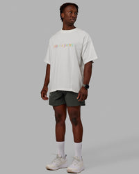 Man wearing Unisex Enjoy The Journey Heavyweight Tee Oversize - Off White-Multi