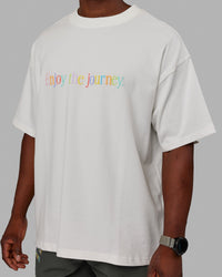 Man wearing Unisex Enjoy The Journey Heavyweight Tee Oversize - Off White-Multi