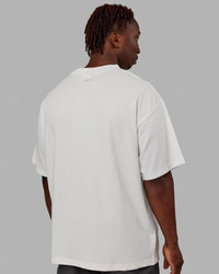 Man wearing Unisex Enjoy The Journey Heavyweight Tee Oversize - Off White-Multi