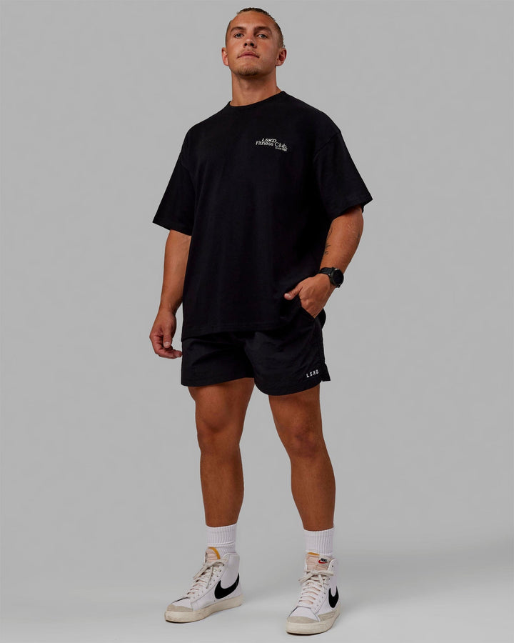 Man wearing Unisex Fitness Club Heavyweight Tee Oversize - Black-Off White