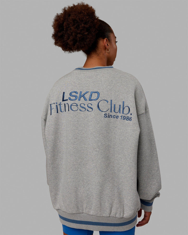 Woman wearing Unisex Fitness Club Sweater Oversize - Lt Grey Marl-Elemental Blue