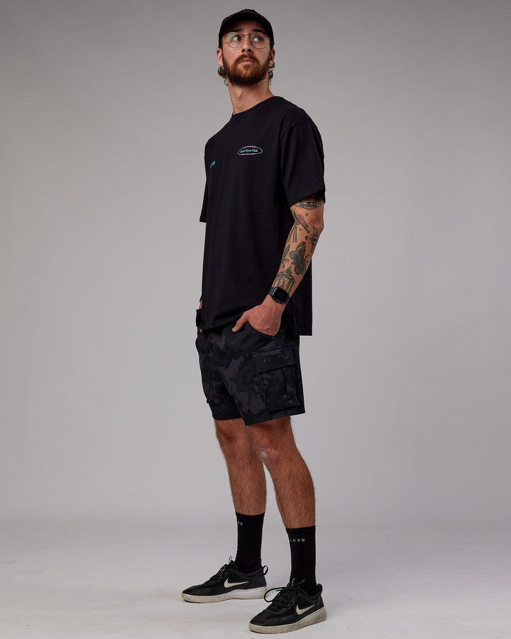 Man wearing Unisex Global Movement FLXCotton Oversize Tee - Black-Multi