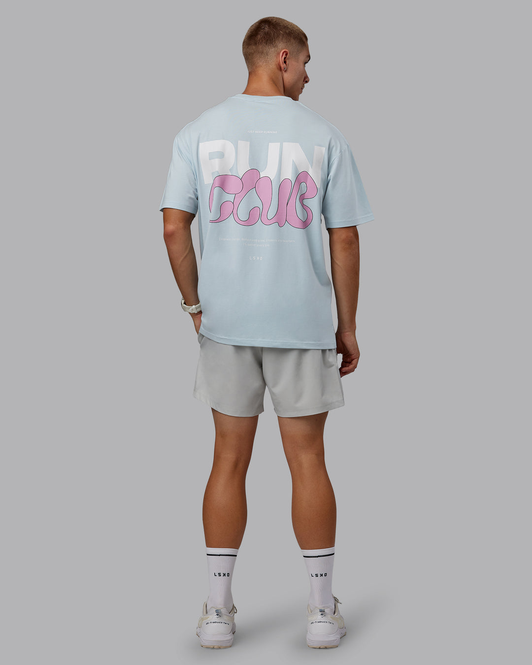 Man wearing Unisex Gone Running FLXCotton Tee Oversize - Skyride-Bubblegum - view 12