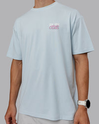 Man wearing Unisex Gone Running FLXCotton Tee Oversize - Skyride-Bubblegum | Thumbnail Index: 7