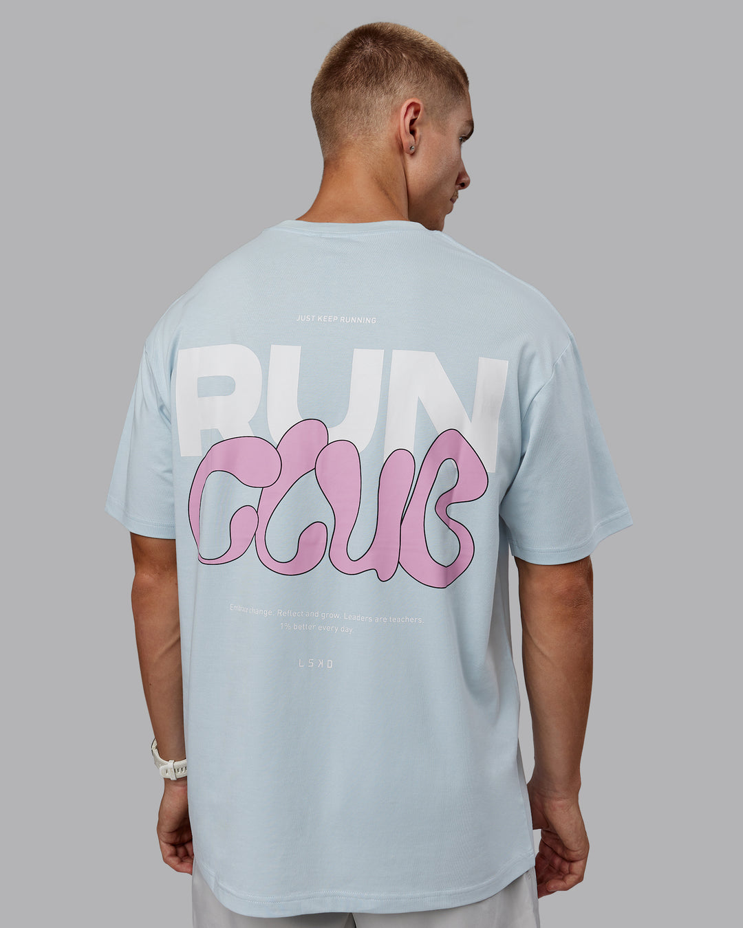 Man wearing Unisex Gone Running FLXCotton Tee Oversize - Skyride-Bubblegum - view 9