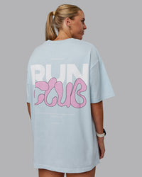 Woman wearing Unisex Gone Running FLXCotton Tee Oversize - Skyride-Bubblegum | Thumbnail Index: 1