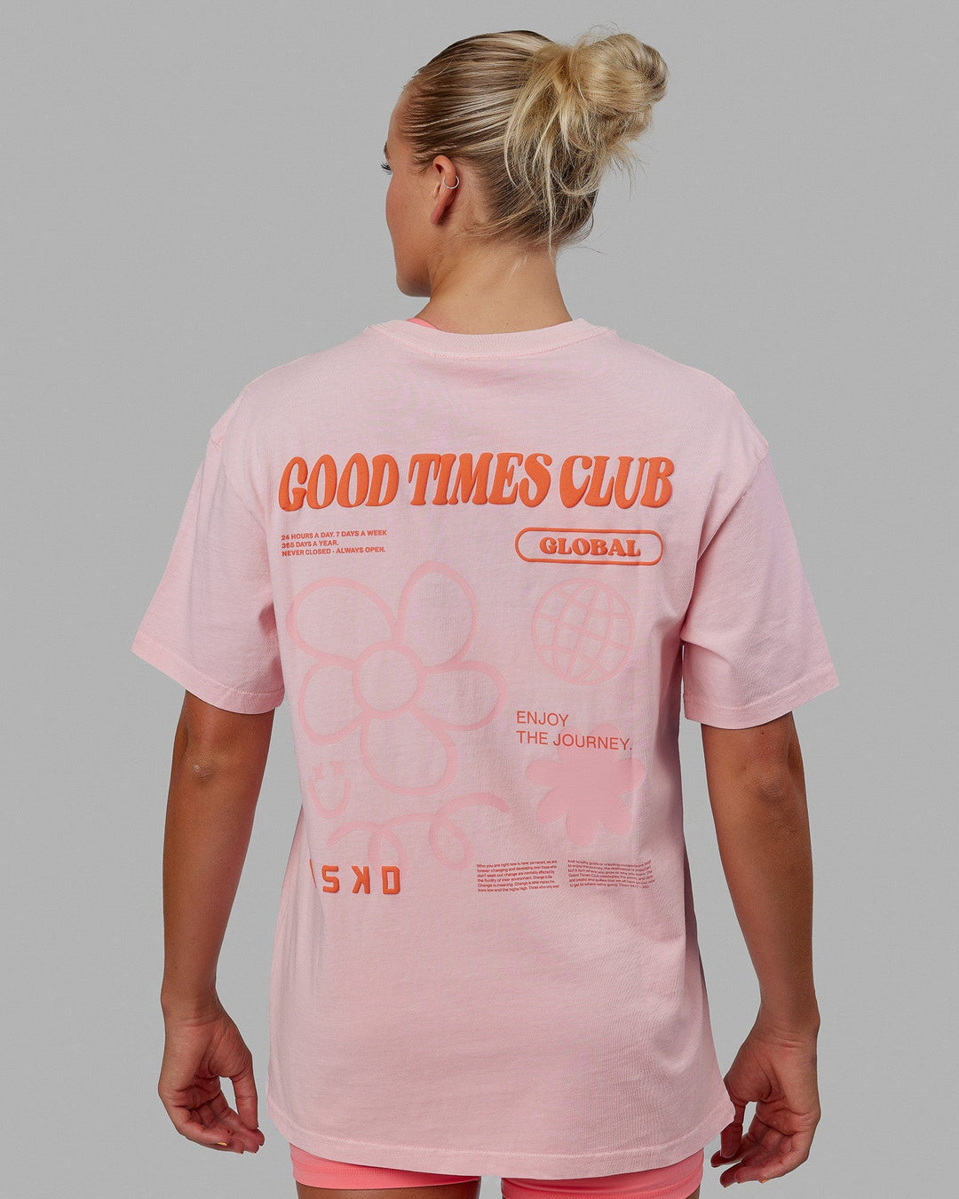 Woman wearing Unisex Good Times Global Heavyweight Tee Oversize - Marshmallow-Pink-Red