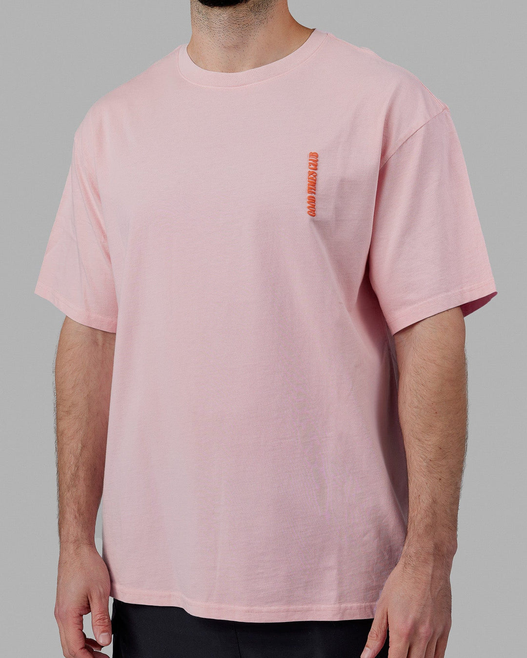Man wearing Unisex Good Times Global Heavyweight Tee Oversize - Marshmallow-Pink-Red