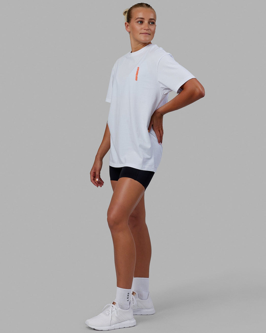 Woman wearing Unisex Good Times Global Heavyweight Tee Oversize - White-Red-Purple