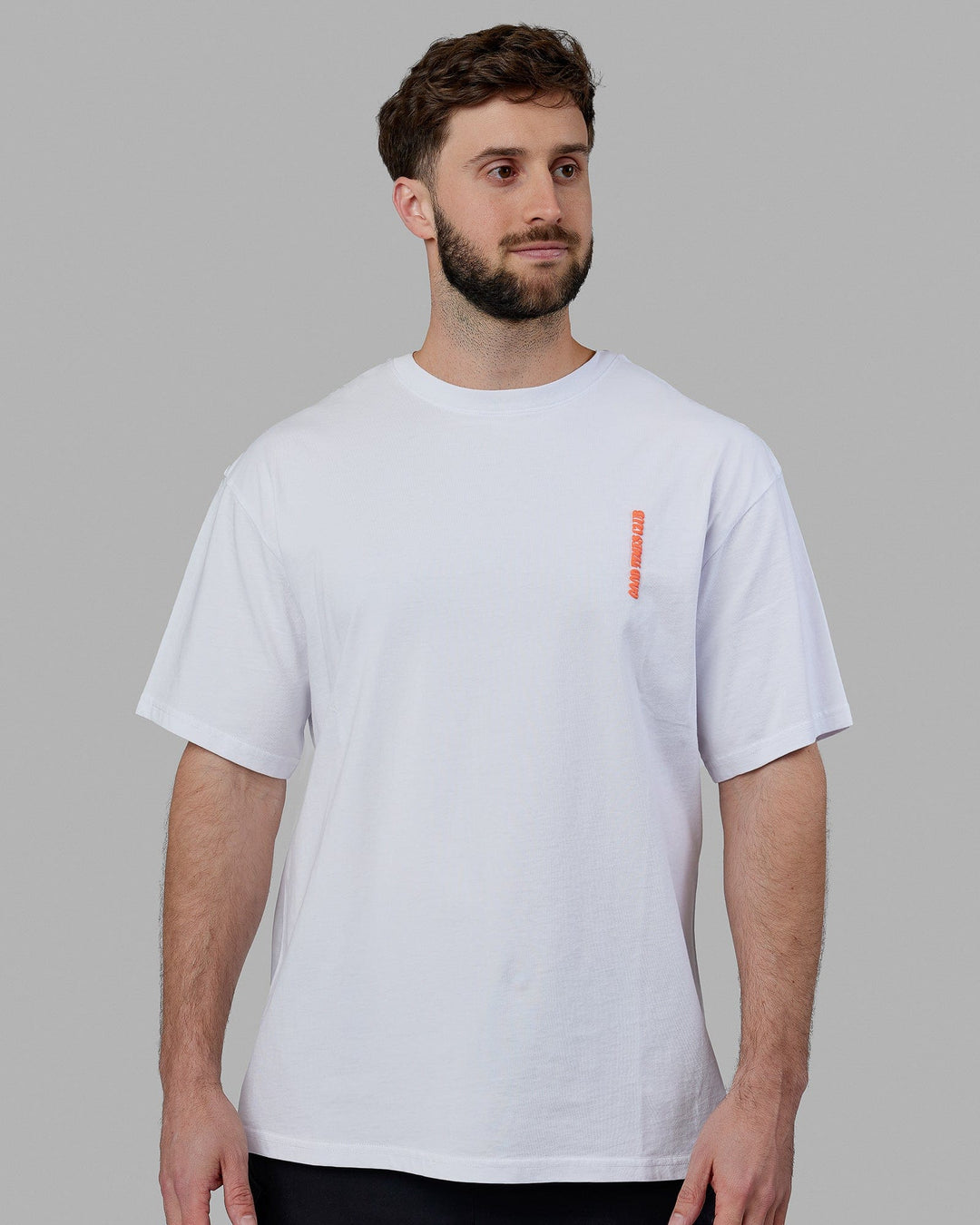 Man wearing Unisex Good Times Global Heavyweight Tee Oversize - White-Red-Purple