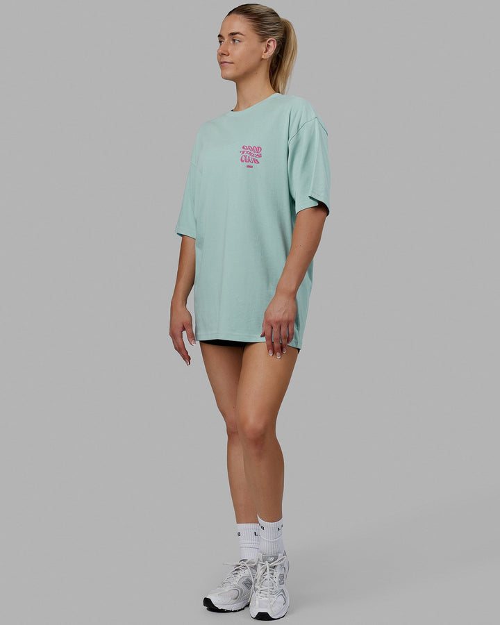Woman wearing Unisex Good Times Heavyweight Tee Oversize - Pastel Turquoise-Spark Pink