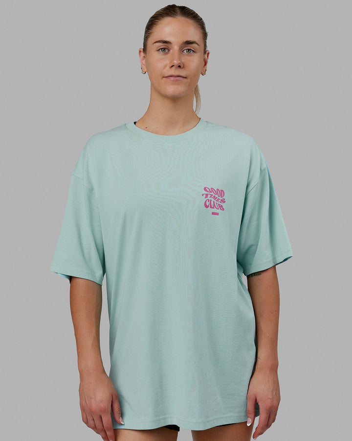 Woman wearing Unisex Good Times Heavyweight Tee Oversize - Pastel Turquoise-Spark Pink