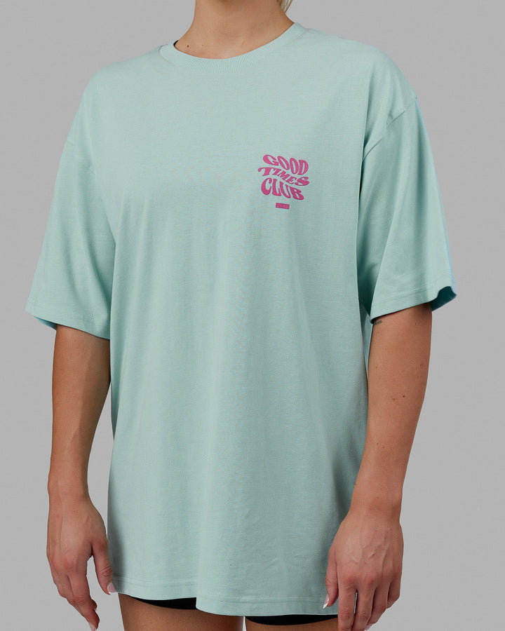 Woman wearing Unisex Good Times Heavyweight Tee Oversize - Pastel Turquoise-Spark Pink